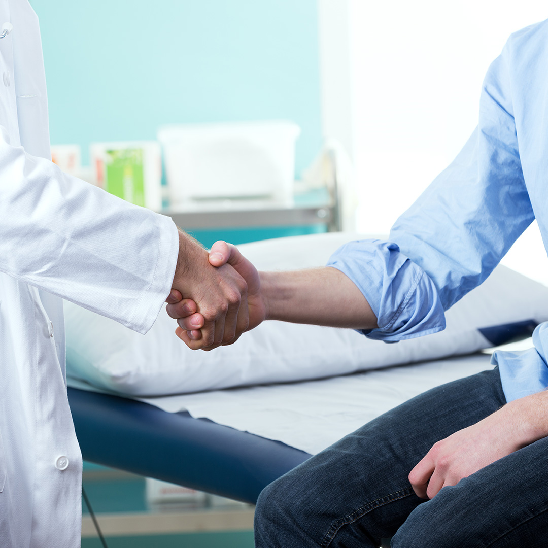 person shaking hands with doctor