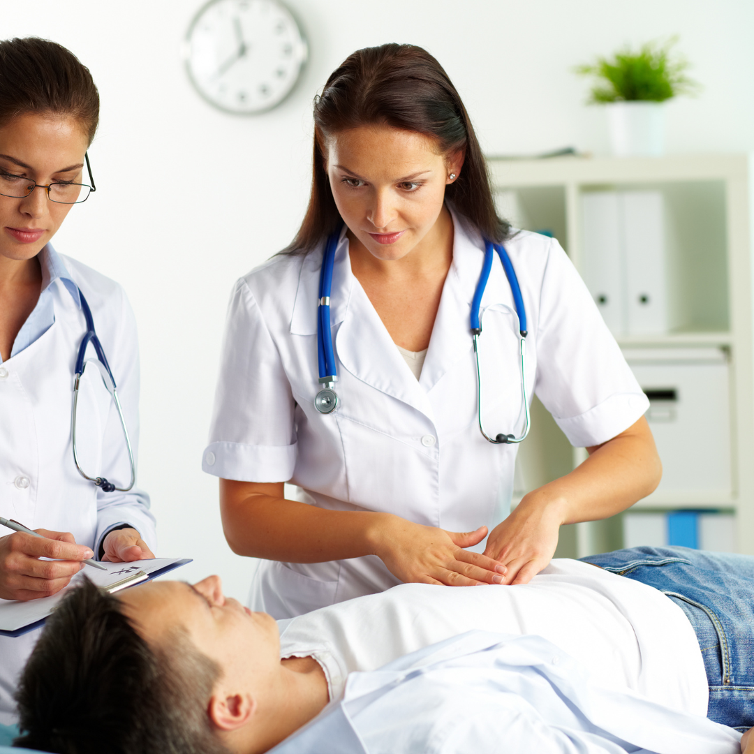 Image of a doctor looking down at a patient