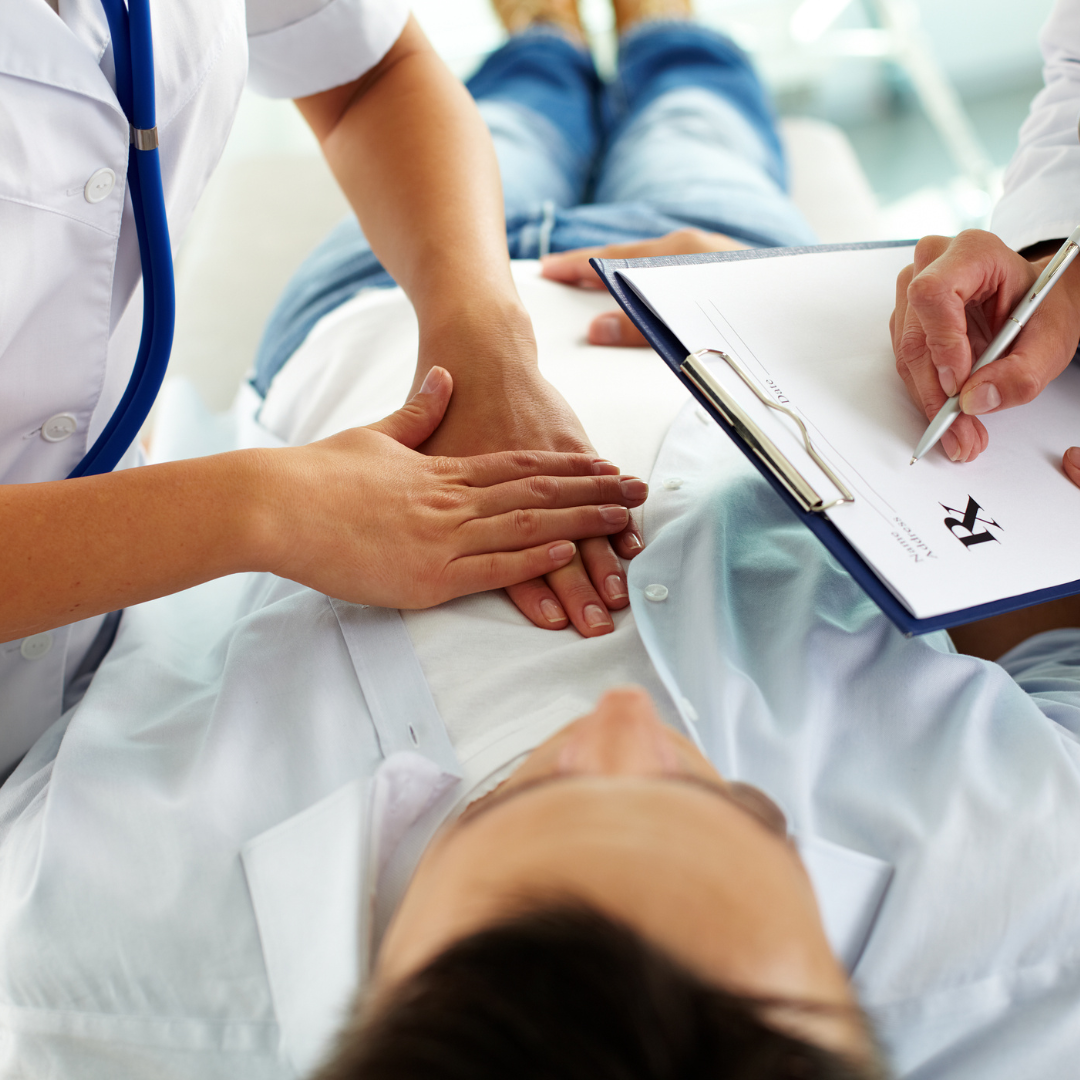 Image of a doctor getting ready to do chest compressions