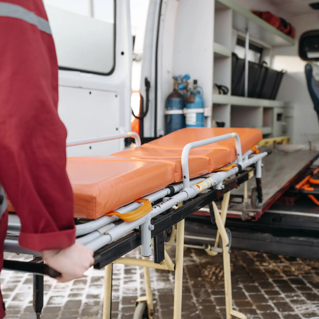 a gurney being unloaded from an ambulance