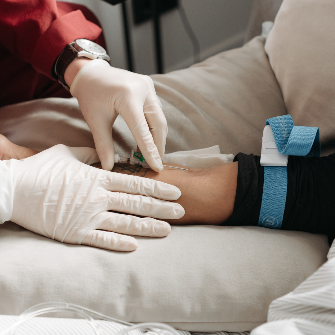 A medical professional placing an iv