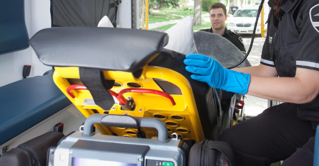 a person being loaded into an ambulance