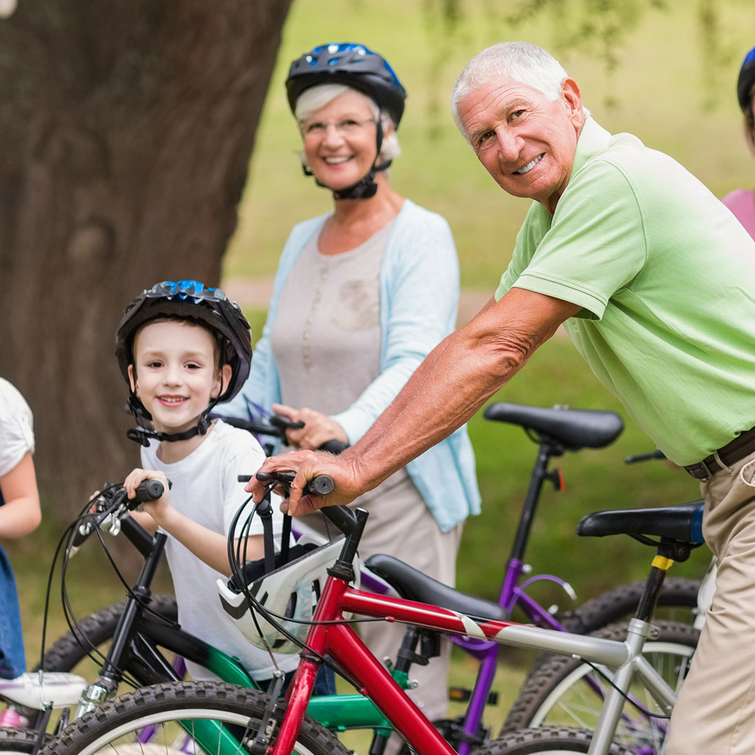 mulitgenerational family riding bikes