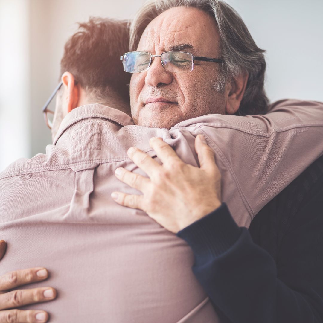 a father hugging his son